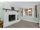 Living room featuring a whitewashed brick fireplace at 3104 Domino Dr, Holiday, FL 34691