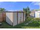 Rustic metal storage shed in the backyard at 3104 Domino Dr, Holiday, FL 34691