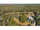 Aerial view showing home with a pool, surrounded by trees at 33288 Ridge Manor Blvd, Dade City, FL 33523