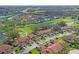 Aerial view of community, highlighting a home near golf course and pond at 3416 Lori Ln # 4, New Port Richey, FL 34655