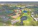 Aerial view showing property location near a pond at 3416 Lori Ln # 4, New Port Richey, FL 34655