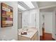 Bathroom with vanity, mirror and view to hallway at 3416 Lori Ln # 4, New Port Richey, FL 34655