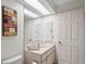 Bright bathroom with vanity and large mirror at 3416 Lori Ln # 4, New Port Richey, FL 34655