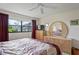 Spacious bedroom with large bed, dresser, and window at 3416 Lori Ln # 4, New Port Richey, FL 34655