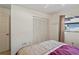 Well-lit bedroom with double closet and window at 3416 Lori Ln # 4, New Port Richey, FL 34655