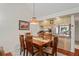 Bright dining area with a wooden table and chairs, kitchen views at 3416 Lori Ln # 4, New Port Richey, FL 34655