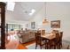 Dining area with wood table and chairs, overlooking the living room at 3416 Lori Ln # 4, New Port Richey, FL 34655