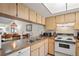 Efficient kitchen featuring ample counter space and white appliances at 3416 Lori Ln # 4, New Port Richey, FL 34655