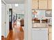 View through the kitchen to the living room with hardwood floors at 3416 Lori Ln # 4, New Port Richey, FL 34655