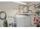 Interior laundry room with washer, dryer, and shelving at 3416 Lori Ln # 4, New Port Richey, FL 34655