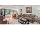 Living room with hardwood floors, canal view, and comfortable seating at 3416 Lori Ln # 4, New Port Richey, FL 34655