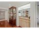 Home features a wet bar with a sink and glass-front cabinetry at 3416 Lori Ln # 4, New Port Richey, FL 34655
