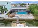 Aerial view showing home, pool, and canal access at 4078 Orient Dr, Hernando Beach, FL 34607