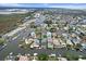 Aerial view of waterfront homes and boats in a canal community at 4078 Orient Dr, Hernando Beach, FL 34607