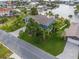 Aerial view of a waterfront home with lush landscaping and a large driveway at 4523 Gulfstream Dr, Hernando Beach, FL 34607