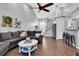 Open concept living room with sectional sofa and a view into the kitchen at 5632 Wesson Rd, New Port Richey, FL 34655