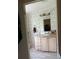 Functional bathroom with a vanity and mirror, plus storage at 6434 Garvey Dr, New Port Richey, FL 34652