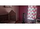 bedroom with crib and window at 6434 Garvey Dr, New Port Richey, FL 34652