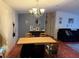 Charming dining area with a decorative chandelier and room for Gathering gatherings at 6434 Garvey Dr, New Port Richey, FL 34652