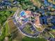 Aerial view of community clubhouse, pool, and golf course at 6594 Brambleleaf Dr, Spring Hill, FL 34606