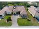 Aerial view of house with paved driveway and manicured lawn at 9144 Alexandria Dr, Weeki Wachee, FL 34613