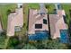 Aerial view of two homes with pools and solar panels at 9144 Alexandria Dr, Weeki Wachee, FL 34613