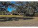 House nestled amongst mature trees on a large lot at 10525 Hilltop Dr, New Port Richey, FL 34654