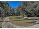 Large backyard with circular driveway at 10525 Hilltop Dr, New Port Richey, FL 34654