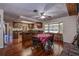 Open dining area with kitchen view and wood flooring at 10525 Hilltop Dr, New Port Richey, FL 34654