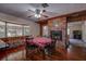 Cozy dining area with brick fireplace and wood flooring at 10525 Hilltop Dr, New Port Richey, FL 34654