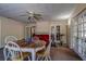 Casual dining room with french doors and hardwood floors at 10525 Hilltop Dr, New Port Richey, FL 34654