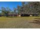 Ranch-style home with mature landscaping and a spacious yard at 10525 Hilltop Dr, New Port Richey, FL 34654