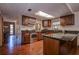 Kitchen with dark wood cabinets, granite countertops, and stainless steel appliances at 10525 Hilltop Dr, New Port Richey, FL 34654