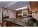 Modern kitchen with granite countertops and stainless steel appliances at 10525 Hilltop Dr, New Port Richey, FL 34654