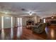 Spacious living area with hardwood floors, fireplace, and lots of natural light at 10525 Hilltop Dr, New Port Richey, FL 34654