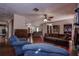 Living room with hardwood floors, comfortable seating, and built-in shelving at 10525 Hilltop Dr, New Port Richey, FL 34654