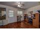 Home office with rocking chair and wood flooring at 10525 Hilltop Dr, New Port Richey, FL 34654