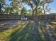 Small backyard with patio furniture and wooden fence at 11200 Homeway St, Spring Hill, FL 34609