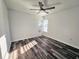 Bright bedroom with ceiling fan and vinyl plank flooring at 11200 Homeway St, Spring Hill, FL 34609