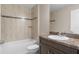 Clean bathroom with tub, toilet, sink and vanity at 11359 Flower Ave, Weeki Wachee, FL 34613