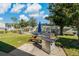Outdoor grilling area with picnic tables and umbrellas at 12141 Spartan Way # 204, Hudson, FL 34667
