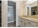 Bathroom with granite vanity and shower at 12141 Spartan Way # 204, Hudson, FL 34667