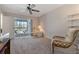 Bedroom with sliding glass doors leading to a balcony at 12141 Spartan Way # 204, Hudson, FL 34667