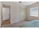 Spacious bedroom with a view and access to a hallway at 12141 Spartan Way # 204, Hudson, FL 34667