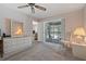 Bedroom with sliding door to balcony and ceiling fan at 12141 Spartan Way # 204, Hudson, FL 34667