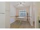 Small dining area with an octagonal table and wood flooring at 12141 Spartan Way # 204, Hudson, FL 34667