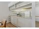 Kitchen features granite countertops and white cabinets at 12141 Spartan Way # 204, Hudson, FL 34667