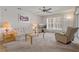 Living room with sofa, recliner, and coffee table at 12141 Spartan Way # 204, Hudson, FL 34667
