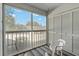 Relaxing screened balcony with outdoor seating and view at 12141 Spartan Way # 204, Hudson, FL 34667