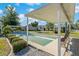 Community shuffleboard courts with covered seating areas at 12141 Spartan Way # 204, Hudson, FL 34667